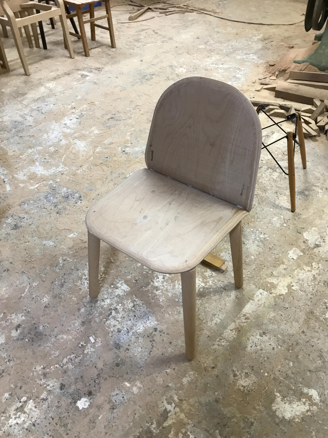 Bent ply chair on workshop floor