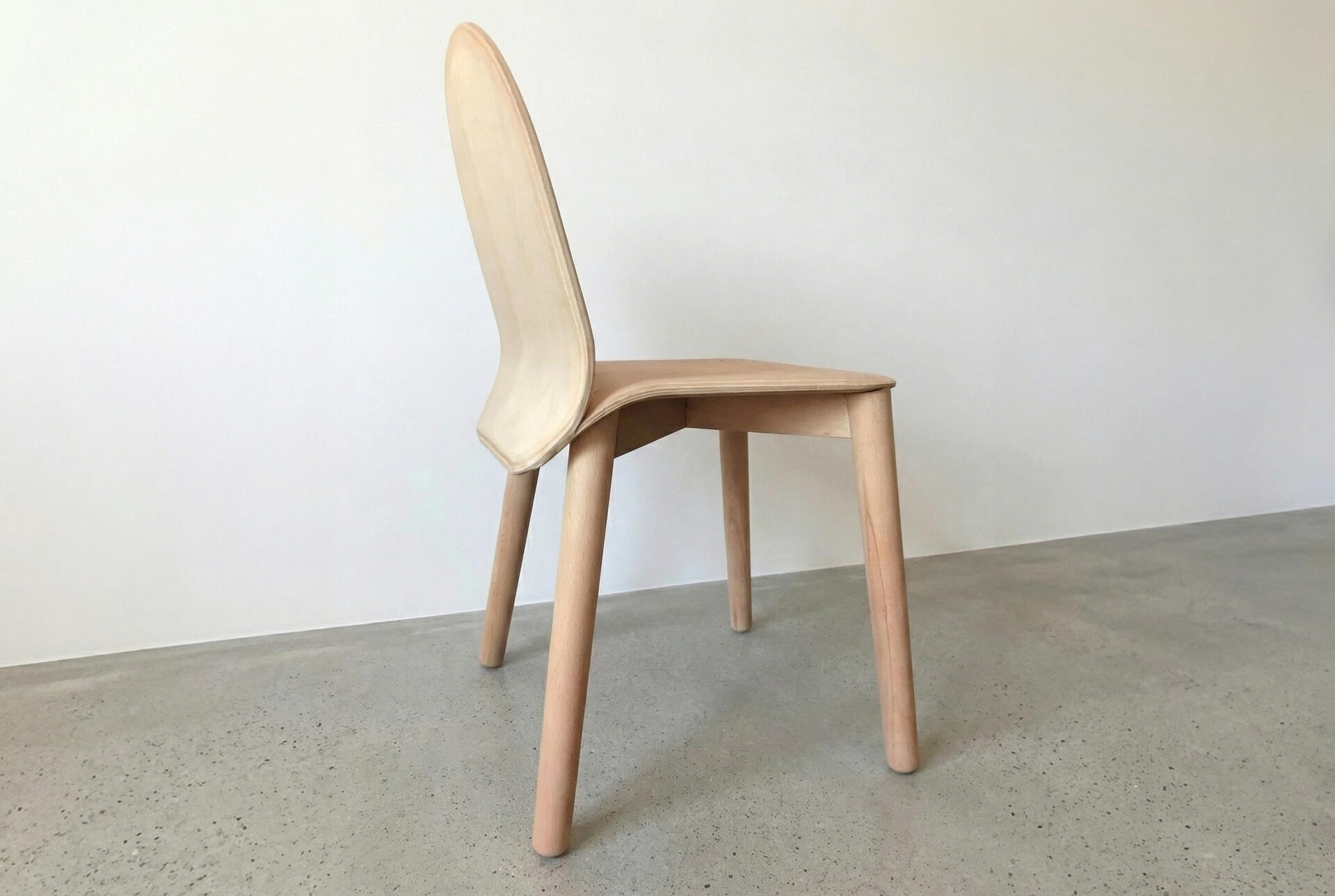 Bent ply chair hero shot side back
